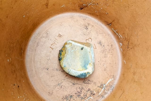 Rock covering the drainage hole